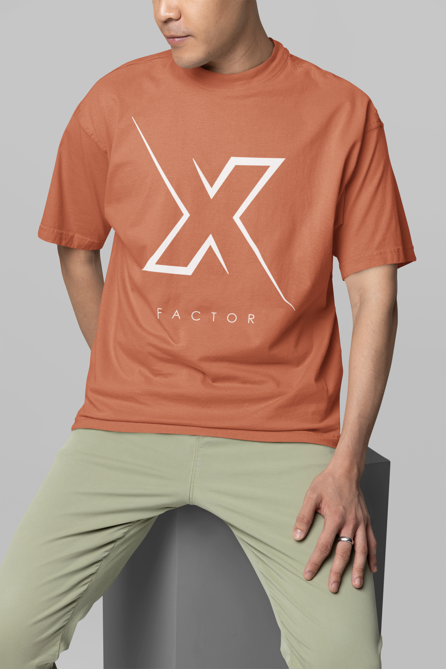 Taurus Monk X Factor Oversized Graphic T-Shirt in Coral – bold oversized X print tee